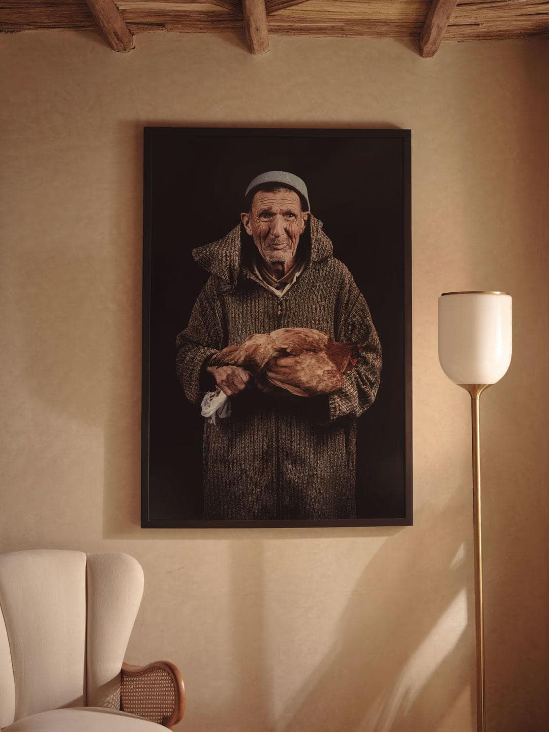 Framed portrait artwork on tadelakt wall